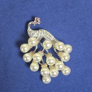 Elegant Silver and Pearl Peacock Brooch